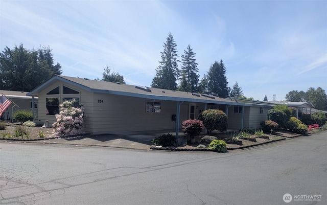201 Union Ave SE Unit 234, Renton, WA 98059 - view of front facade with an attached carport