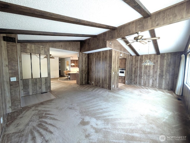 201 Union Ave SE Unit 234, Renton, WA 98059 - unfurnished living room with ceiling fan, wooden walls, and carpet