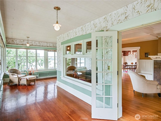 215 N Forest St, Bellingham, WA 98225 - sunroom featuring wallpapered walls, radiator, and wood finished floors