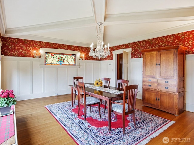 215 N Forest St, Bellingham, WA 98225 - dining area featuring a chandelier, a decorative wall, wallpapered walls, light wood finished floors, and beamed ceiling