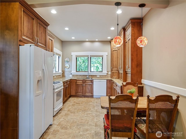 215 N Forest St, Bellingham, WA 98225 - kitchen with white appliances, brown cabinetry, light stone counters, recessed lighting, and backsplash