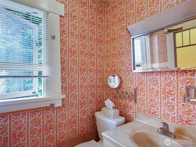 215 N Forest St, Bellingham, WA 98225 - bathroom with plenty of natural light, wallpapered walls, and vanity