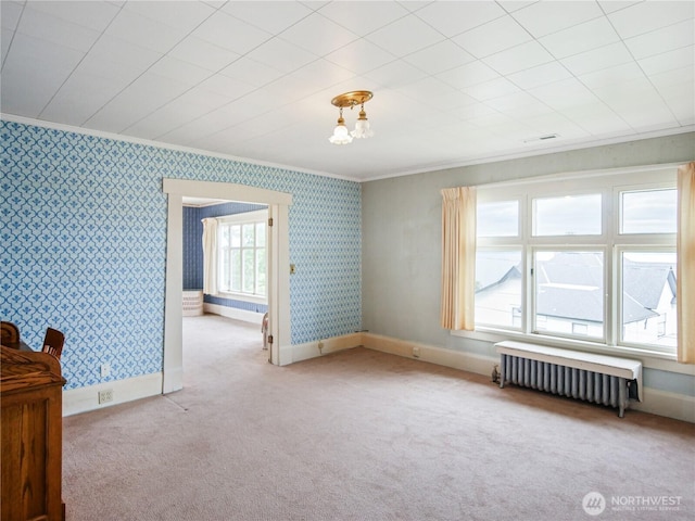 215 N Forest St, Bellingham, WA 98225 - carpeted spare room with radiator heating unit, wallpapered walls, and ornamental molding