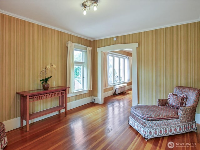 215 N Forest St, Bellingham, WA 98225 - sitting room with radiator heating unit, crown molding, and wood finished floors
