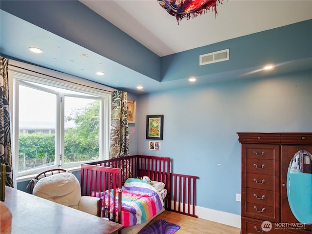 215 N Forest St, Bellingham, WA 98225 - bedroom featuring wood finished floors, multiple windows, and recessed lighting