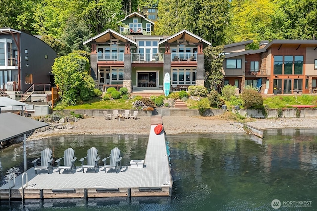 1624 Mallard Ln, Bellevue, WA 98008 - rear view of property featuring a water view, stone siding, and a balcony