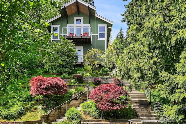 1624 Mallard Ln, Bellevue, WA 98008 - view of front of home with stairs, a balcony, and board and batten siding