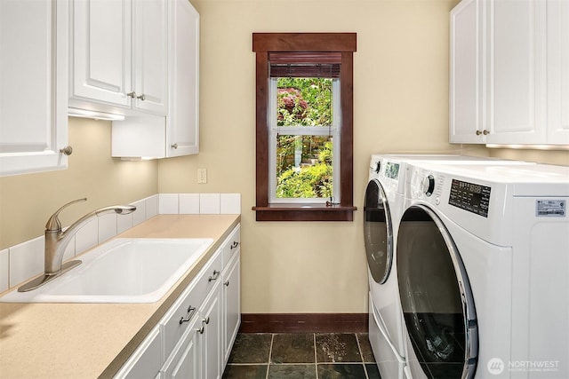 1624 Mallard Ln, Bellevue, WA 98008 - washroom featuring cabinet space, independent washer and dryer, and baseboards