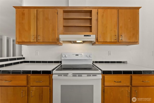 kitchen with white range with electric cooktop, under cabinet range hood, open shelves, and tile counters