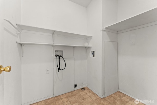 clothes washing area featuring hookup for a washing machine and hookup for an electric dryer