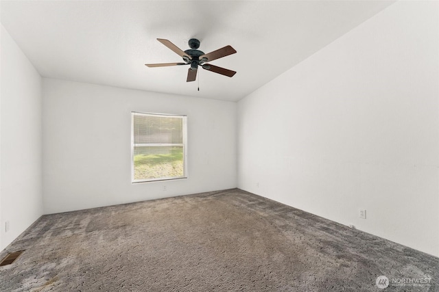 carpeted spare room with ceiling fan