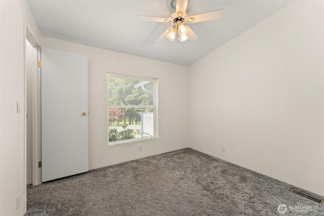 spare room with carpet floors and ceiling fan