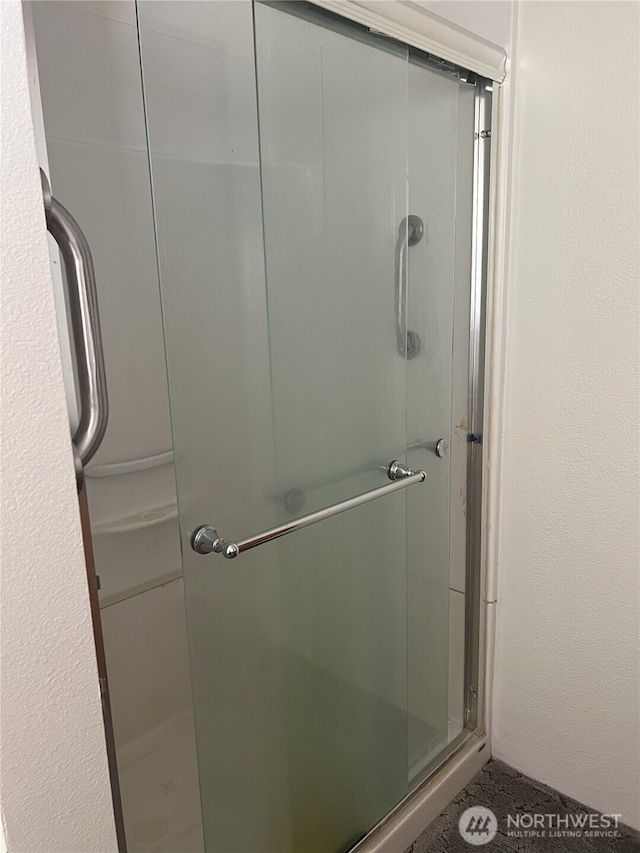 bathroom featuring a shower stall