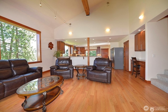 54 Perrow Dr, Winthrop, WA 98862 - living room featuring light wood-style flooring, baseboards, beam ceiling, stairway, and recessed lighting