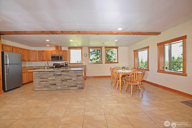 54 Perrow Dr, Winthrop, WA 98862 - kitchen featuring stainless steel appliances, baseboards, recessed lighting, an island with sink, and light tile patterned flooring
