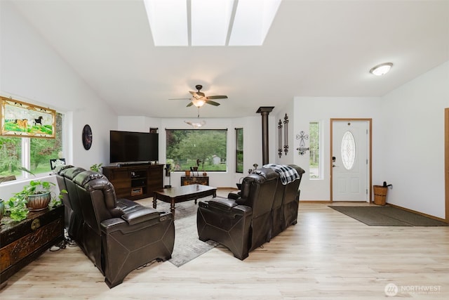760 Lewis Rd W, Seabeck, WA 98380 - living room featuring healthy amount of natural light, light wood-style flooring, a skylight, ceiling fan, and lofted ceiling