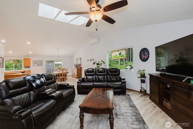 760 Lewis Rd W, Seabeck, WA 98380 - living room featuring ceiling fan, light wood-type flooring, a skylight, lofted ceiling, and a chandelier