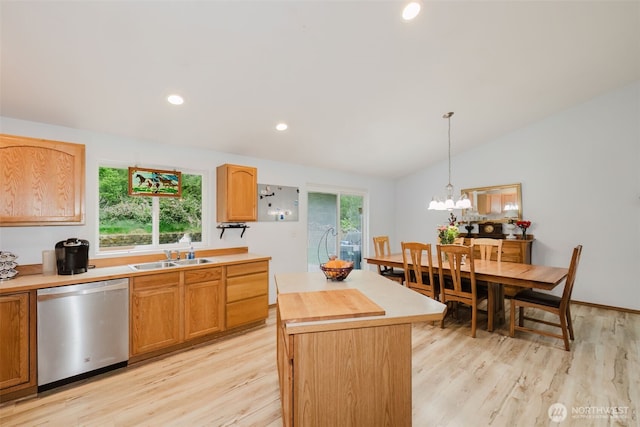 760 Lewis Rd W, Seabeck, WA 98380 - kitchen featuring dishwasher, a sink, light wood-style floors, lofted ceiling, and hanging light fixtures
