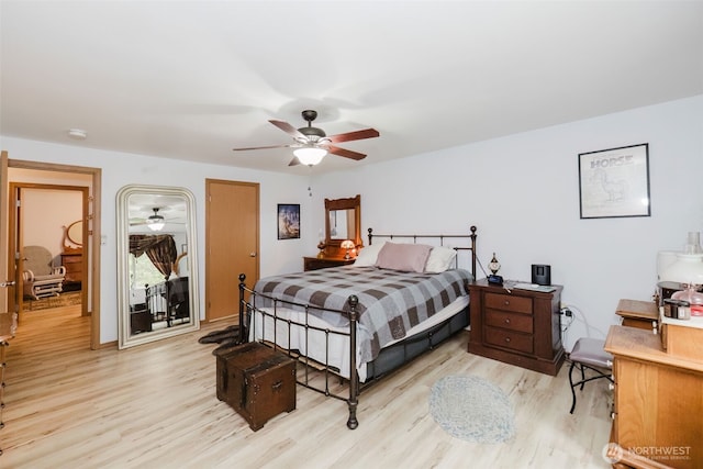 760 Lewis Rd W, Seabeck, WA 98380 - bedroom with light wood-type flooring and a ceiling fan