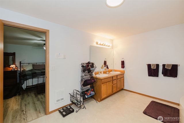 760 Lewis Rd W, Seabeck, WA 98380 - bathroom featuring vanity, baseboards, and a ceiling fan