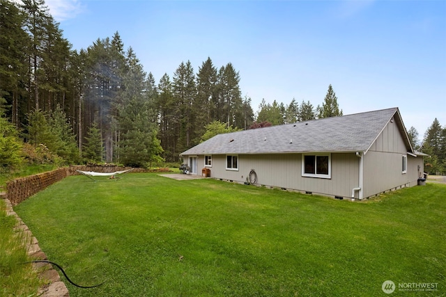 760 Lewis Rd W, Seabeck, WA 98380 - back of property with a lawn and a shingled roof