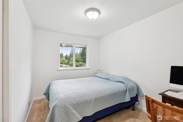 carpeted bedroom with baseboards