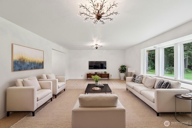 living area featuring a chandelier