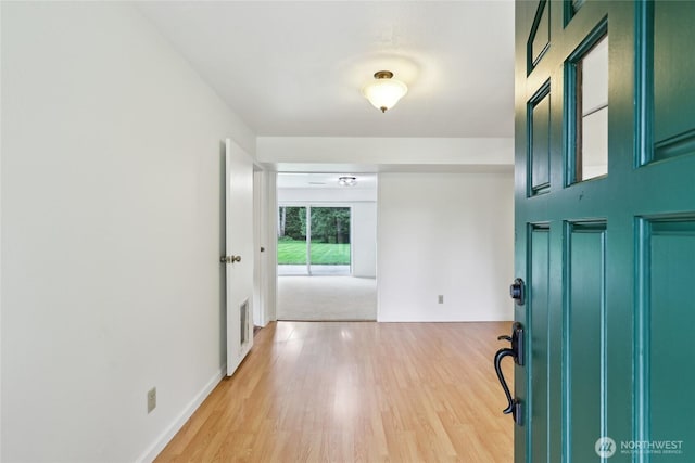 foyer entrance with light wood-style flooring