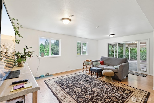 living room with light wood-style floors and baseboards