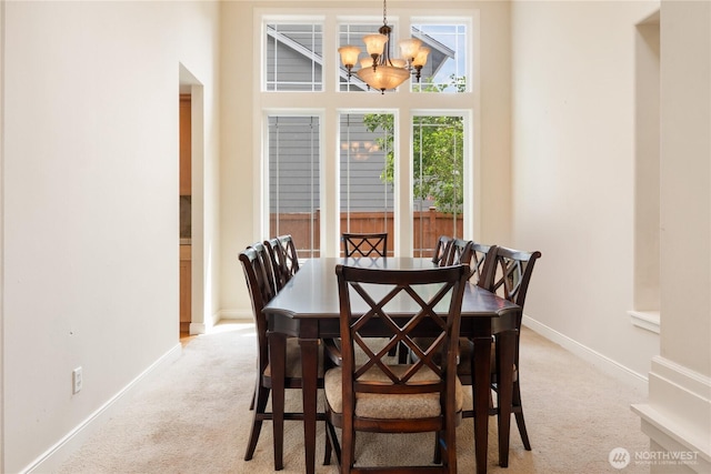 15927 35th Dr SE, Bothell, WA 98012 - dining space featuring light colored carpet and a chandelier