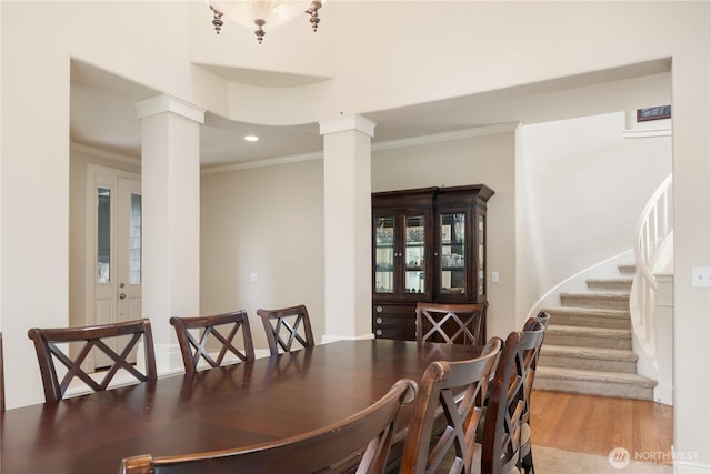15927 35th Dr SE, Bothell, WA 98012 - dining room with ornate columns, crown molding, wood finished floors, stairway, and recessed lighting