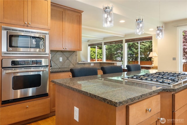 15927 35th Dr SE, Bothell, WA 98012 - kitchen featuring appliances with stainless steel finishes, healthy amount of natural light, dark stone countertops, decorative backsplash, and beam ceiling