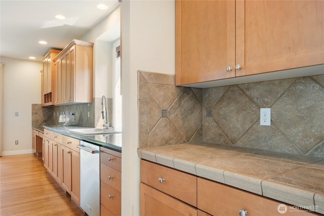 15927 35th Dr SE, Bothell, WA 98012 - kitchen with light wood finished floors, tasteful backsplash, stainless steel dishwasher, recessed lighting, and light countertops