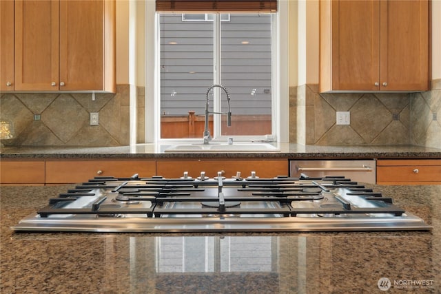 15927 35th Dr SE, Bothell, WA 98012 - kitchen with dishwasher, dark stone countertops, backsplash, and brown cabinets