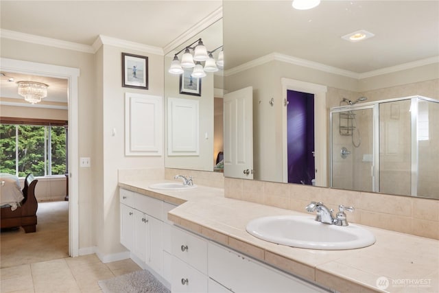 15927 35th Dr SE, Bothell, WA 98012 - ensuite bathroom with double vanity, a stall shower, tile patterned floors, a chandelier, and crown molding