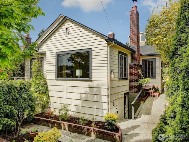 view of home's exterior with a chimney