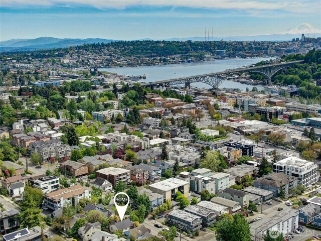 drone / aerial view of a notable bridge and a nearby body of water