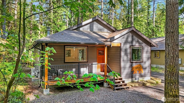 7468 Glacier Springs Dr, Deming, WA 98244 - view of front of house featuring a shingled roof and a porch