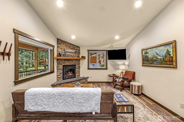 7468 Glacier Springs Dr, Deming, WA 98244 - living area with lofted ceiling, a fireplace, wood finished floors, recessed lighting, and baseboards