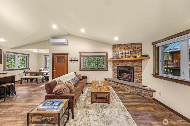7468 Glacier Springs Dr, Deming, WA 98244 - living room featuring a wall mounted air conditioner, wood finished floors, a fireplace, lofted ceiling, and baseboards