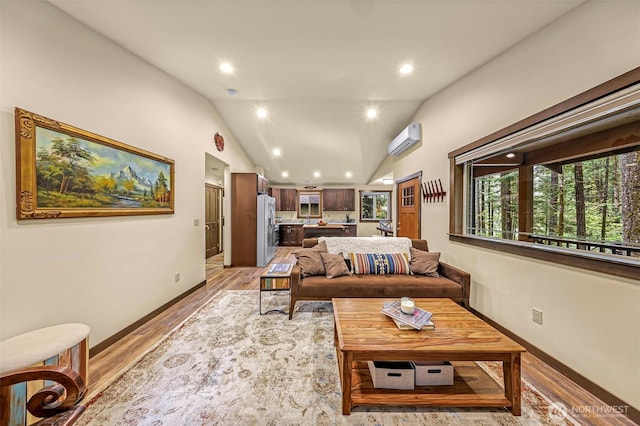 7468 Glacier Springs Dr, Deming, WA 98244 - living area featuring light wood-type flooring, vaulted ceiling, baseboards, a wall mounted air conditioner, and recessed lighting