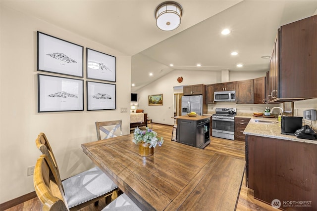 7468 Glacier Springs Dr, Deming, WA 98244 - dining space featuring vaulted ceiling, light wood-style floors, recessed lighting, and baseboards