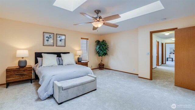 28843 213th Ct SE, Kent, WA 98042 - carpeted bedroom featuring a skylight, baseboards, and ceiling fan