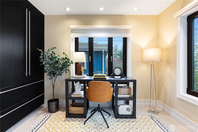 home office with baseboards, plenty of natural light, and recessed lighting