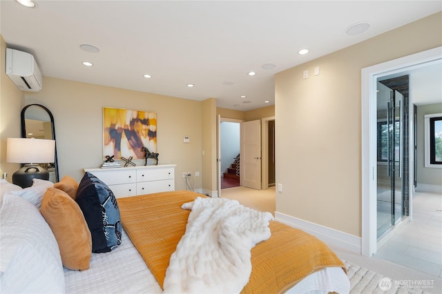 bedroom with a wall unit AC, recessed lighting, and baseboards