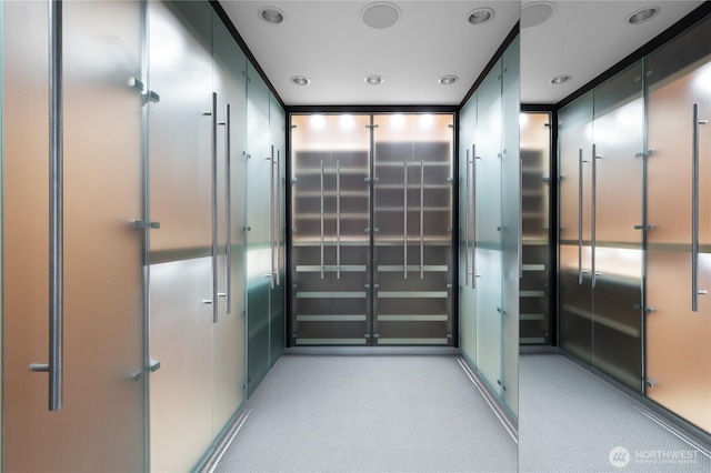 hallway with light colored carpet