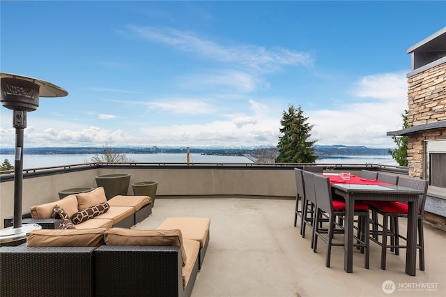 view of patio / terrace featuring an outdoor hangout area and a water view