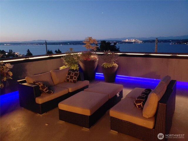 view of patio featuring an outdoor hangout area and a water view