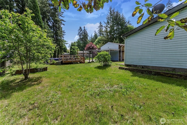 view of yard with a deck