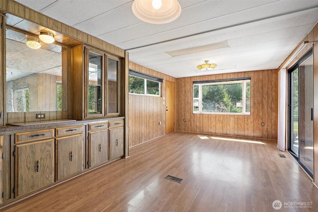 3180 Woodcock Rd, Sequim, WA 98382 - empty room featuring light wood-type flooring and wood walls